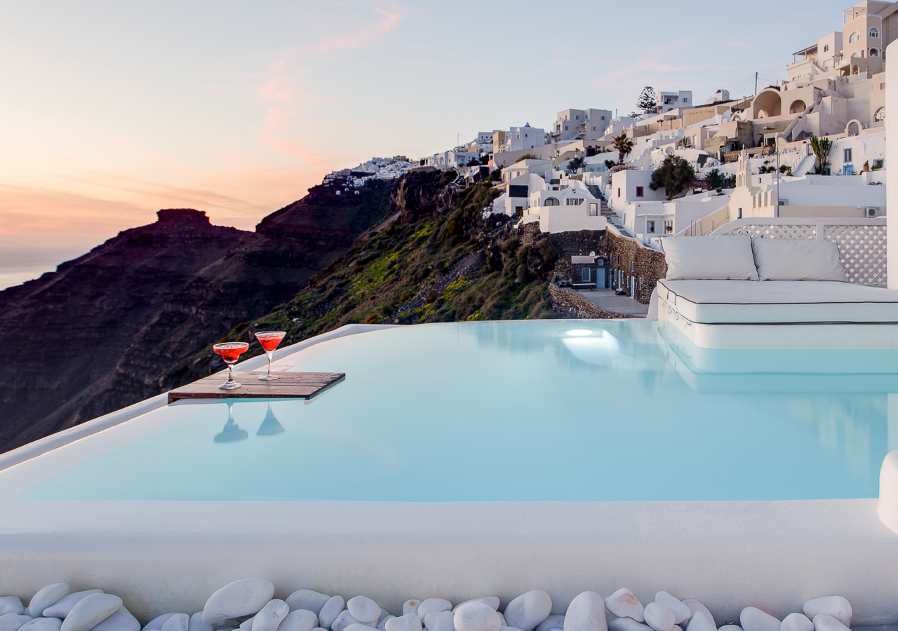 View over caldera from the pool of Dana Villas superior pool suite during sunset