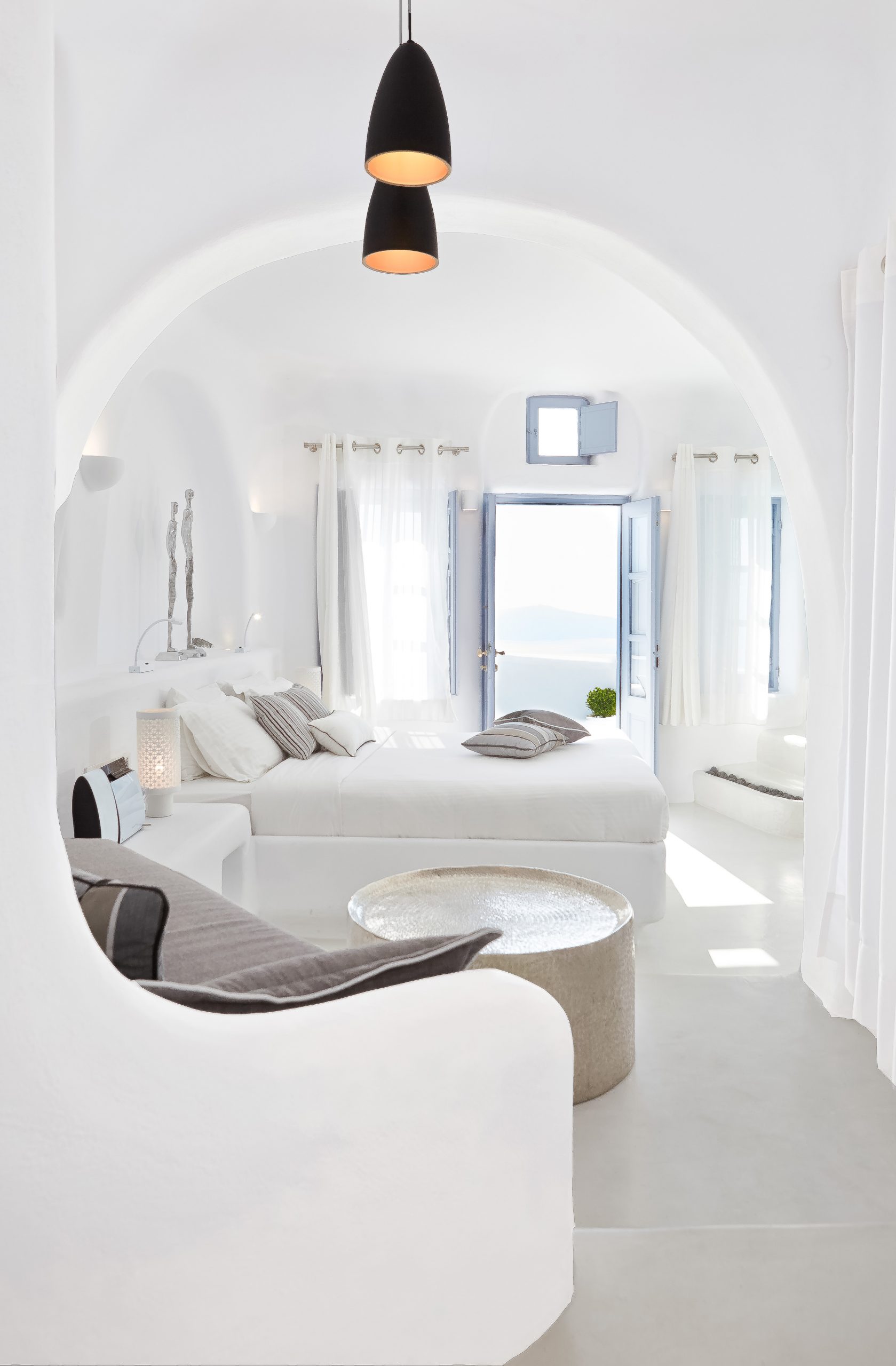 The interior of a bright and modern suite in Dana Villas, Santorini