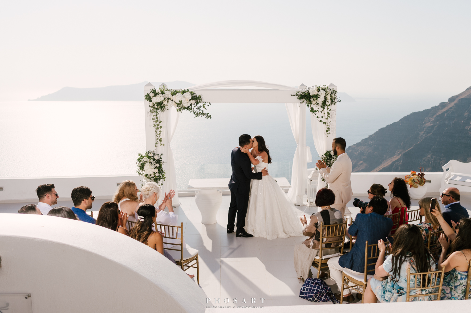 Wedding snapshot on the terrace of Dana Villas overlooking the Aegean Sea and the caldera