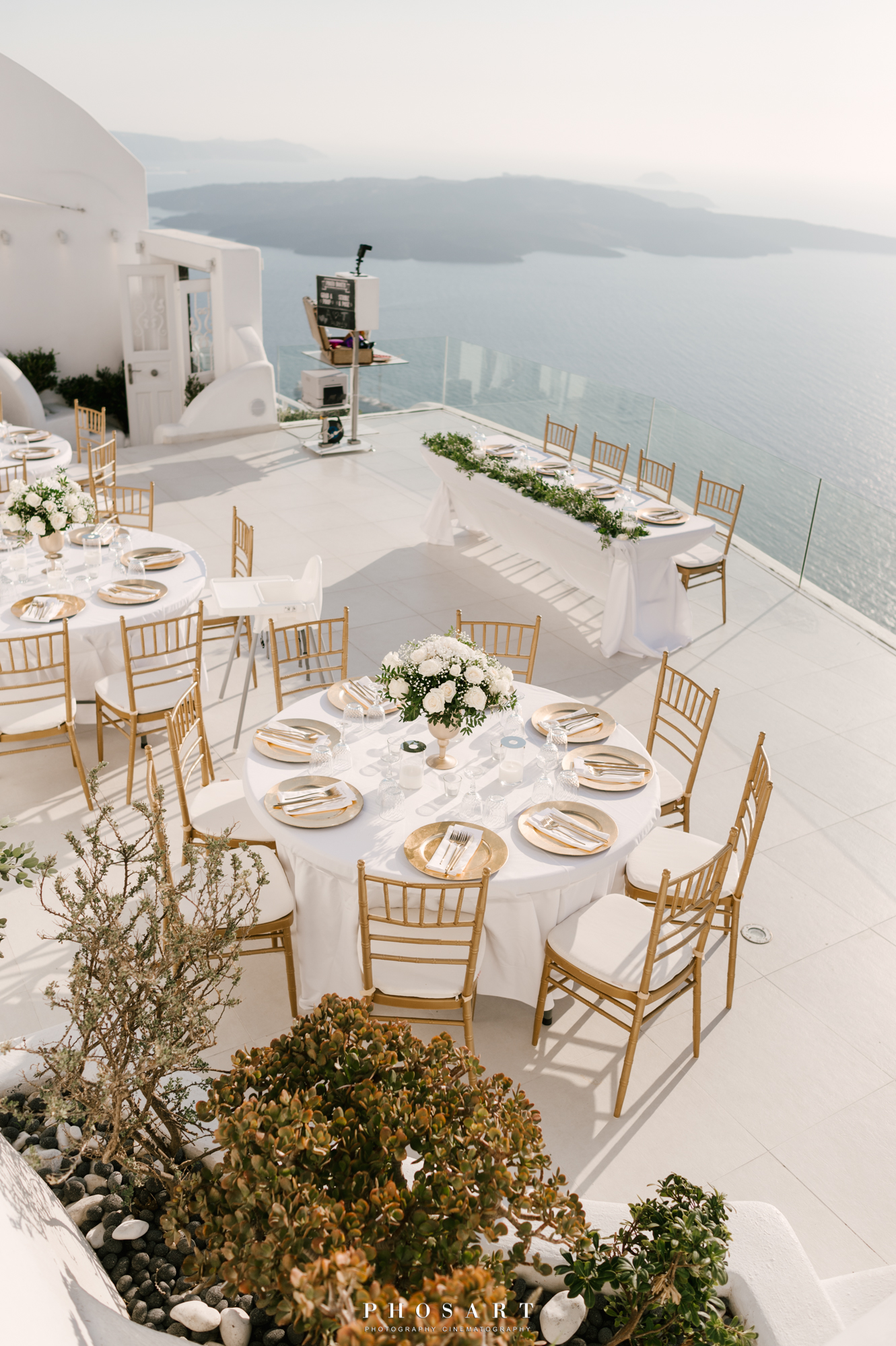 The terrace of Dana Villas & Infinity Suites decorated for a wedding event overlooking the Aegean Sea