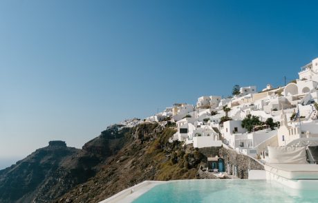 View of houses and hotels on the caldera, photo taken from a suite's outdoor pool in Dana Villas