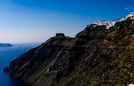 Τhe cliffs and white houses at the top of the island of Santorini
