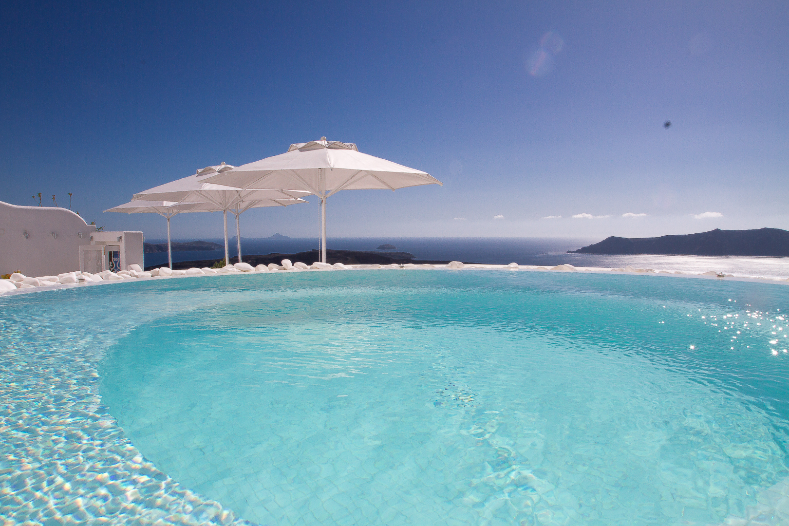 View over the Aegean Sea from the shared pool of Dana Villas & Infinity Suites